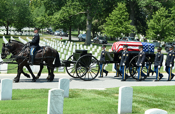 Horse-drawn caisson procession at Arlington National Cemetery