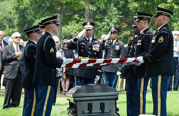 American flag presentation to the Hughes family